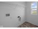 Bright laundry room with shelving and a window that allows plenty of natural light in at 7417 Waylon Way, Indianapolis, IN 46239