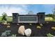 Stone signage with 'Grayson' nameplate, surrounded by lush landscaping at 7417 Waylon Way, Indianapolis, IN 46239