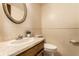 Cozy bathroom featuring a vanity with marble countertop, and matching wall mirror at 7423 Scarborough Blvd E Dr, Indianapolis, IN 46256