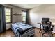 Charming bedroom with two windows providing natural light, perfect for a cozy home office setup at 7423 Scarborough Blvd E Dr, Indianapolis, IN 46256