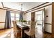 Charming dining room with wood table, decorative chandelier, and natural light at 7423 Scarborough Blvd E Dr, Indianapolis, IN 46256