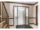 Welcoming entryway featuring a glass paned front door, a staircase, and tile flooring at 7423 Scarborough Blvd E Dr, Indianapolis, IN 46256