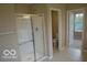 Modern bathroom featuring a glass shower, neutral tile, and separate water closet at 7522 Timberfield Ln, Indianapolis, IN 46259