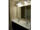 Bathroom featuring double sinks, a large mirror, and a shower/tub combo at 7522 Timberfield Ln, Indianapolis, IN 46259
