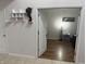 Bedroom view with neutral walls, shelves, and hardwood-style flooring at 7522 Timberfield Ln, Indianapolis, IN 46259