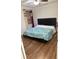 Comfortable bedroom with a stylish bed and ample natural light, creating a serene space at 7522 Timberfield Ln, Indianapolis, IN 46259