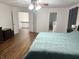 Spacious bedroom featuring hardwood floors, natural lighting, and a calming color scheme at 7522 Timberfield Ln, Indianapolis, IN 46259