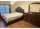 Relaxing bedroom with natural light and a decorative dresser at 7522 Timberfield Ln, Indianapolis, IN 46259
