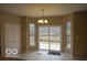 Bright dining area with sliding glass doors leading to the outdoor deck at 7522 Timberfield Ln, Indianapolis, IN 46259