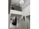 Hallway with chandelier, staircase, and high ceilings at 7522 Timberfield Ln, Indianapolis, IN 46259