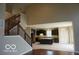 Spacious home with stairs, dark cabinets, light countertops, and open floor plan at 7522 Timberfield Ln, Indianapolis, IN 46259