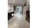 Kitchen with tile flooring and a dog playpen in the corner at 7522 Timberfield Ln, Indianapolis, IN 46259