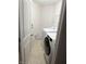 Functional laundry room with modern washer and dryer units for added convenience at 7522 Timberfield Ln, Indianapolis, IN 46259
