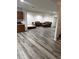 Spacious living room area with wood floors and ample room for seating and lounging at 7522 Timberfield Ln, Indianapolis, IN 46259