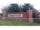 Timberfield community sign with brick pillars and manicured lawn at 7522 Timberfield Ln, Indianapolis, IN 46259
