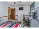 Bedroom features a ceiling fan, workstation, and natural light at 7856 Trotwood Cir, Indianapolis, IN 46256
