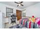Bedroom with a workstation, plush rug, modern decor, and natural light at 7856 Trotwood Cir, Indianapolis, IN 46256