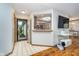 Inviting tiled foyer with an open view to the kitchen, hardwood floors, and ample natural light at 7856 Trotwood Cir, Indianapolis, IN 46256