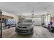 Spacious garage with ample storage space, a car, and a high ceiling at 8031 Edgewood Ct, Plainfield, IN 46168