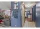 Interior hallway showcasing hardwood floors and a view of the dining area at 8031 Edgewood Ct, Plainfield, IN 46168