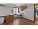 Convenient laundry room with sink, cabinetry, and folding counter and wood look flooring at 8031 Edgewood Ct, Plainfield, IN 46168