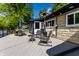 Outdoor back deck with comfortable seating, a patio heater, and ample space for entertaining at 845 W 77Th St S Dr, Indianapolis, IN 46260