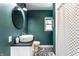 Stylish bathroom with vessel sink, black and white tile flooring, and a shower-tub combo at 845 W 77Th St S Dr, Indianapolis, IN 46260