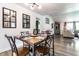 Dining room featuring a wood table, black metal chairs, modern lighting, and stylish decor at 845 W 77Th St S Dr, Indianapolis, IN 46260