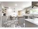 Charming kitchen featuring black and white patterned floors, light gray cabinets, and an island with butcher block top at 845 W 77Th St S Dr, Indianapolis, IN 46260