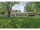 Spacious backyard with the home's exterior in view at 846 W 56Th St, Indianapolis, IN 46228