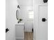 Modern bathroom with sleek fixtures, new vanity, shower and plenty of light at 846 W 56Th St, Indianapolis, IN 46228