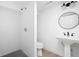 Modern bathroom featuring a walk-in shower and pedestal sink at 846 W 56Th St, Indianapolis, IN 46228
