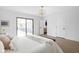 Bedroom with a sliding glass door, leading to the backyard, and view into the bathroom at 846 W 56Th St, Indianapolis, IN 46228