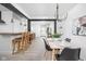 Open concept dining room featuring modern lighting and decor, adjacent to kitchen and living room at 846 W 56Th St, Indianapolis, IN 46228