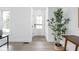 Bright entryway features modern finishes and decor, including a potted plant and new flooring at 846 W 56Th St, Indianapolis, IN 46228