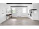 Bright entryway featuring wood floors, white walls, and a decorative fireplace at 846 W 56Th St, Indianapolis, IN 46228