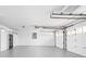Spacious garage with white walls and ample storage space and two garage doors at 846 W 56Th St, Indianapolis, IN 46228