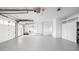 Clean and spacious garage with storage space, entry door, and two car garage door at 846 W 56Th St, Indianapolis, IN 46228