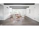 Bright living room features dark wood beams, accent chairs, and views of backyard at 846 W 56Th St, Indianapolis, IN 46228