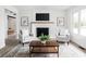 Cozy living room featuring fireplace, mantle with TV, and two chairs over an area rug at 846 W 56Th St, Indianapolis, IN 46228