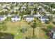 An aerial view of a quiet neighborhood with well-maintained lawns and mature trees at 9037 Carnation Dr, Noblesville, IN 46060