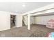 Spacious finished basement with carpet, play area and visible staircase at 9037 Carnation Dr, Noblesville, IN 46060