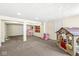 Finished basement area featuring carpet flooring, recessed lighting, and multiple play areas at 9037 Carnation Dr, Noblesville, IN 46060