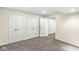 Spacious basement area with neutral carpet, paint, white trim, and multiple closets at 9037 Carnation Dr, Noblesville, IN 46060