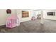 Finished basement area with neutral walls, carpet floors and a play area at 9037 Carnation Dr, Noblesville, IN 46060
