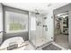 Bathroom with a large walk-in shower featuring a glass enclosure and a walk-in closet at 9037 Carnation Dr, Noblesville, IN 46060