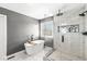 Modern bathroom featuring a freestanding tub with a caddy and a glass-enclosed shower at 9037 Carnation Dr, Noblesville, IN 46060
