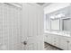 Elegant bathroom showcases double sinks, sophisticated lighting, and a shower accessible through an open door at 9037 Carnation Dr, Noblesville, IN 46060
