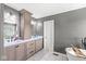 Bright bathroom with double sink vanity, a soaking tub and modern fixtures at 9037 Carnation Dr, Noblesville, IN 46060