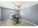Functional bedroom featuring a ceiling fan, neutral carpet, and a desk making it suitable for work or study at 9037 Carnation Dr, Noblesville, IN 46060